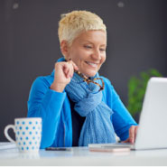 Smiling woman on computer
